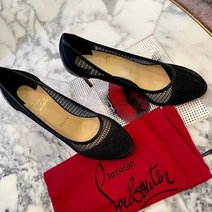 Christian Louboutin 
Mesh and buffed calfskin heels in black.